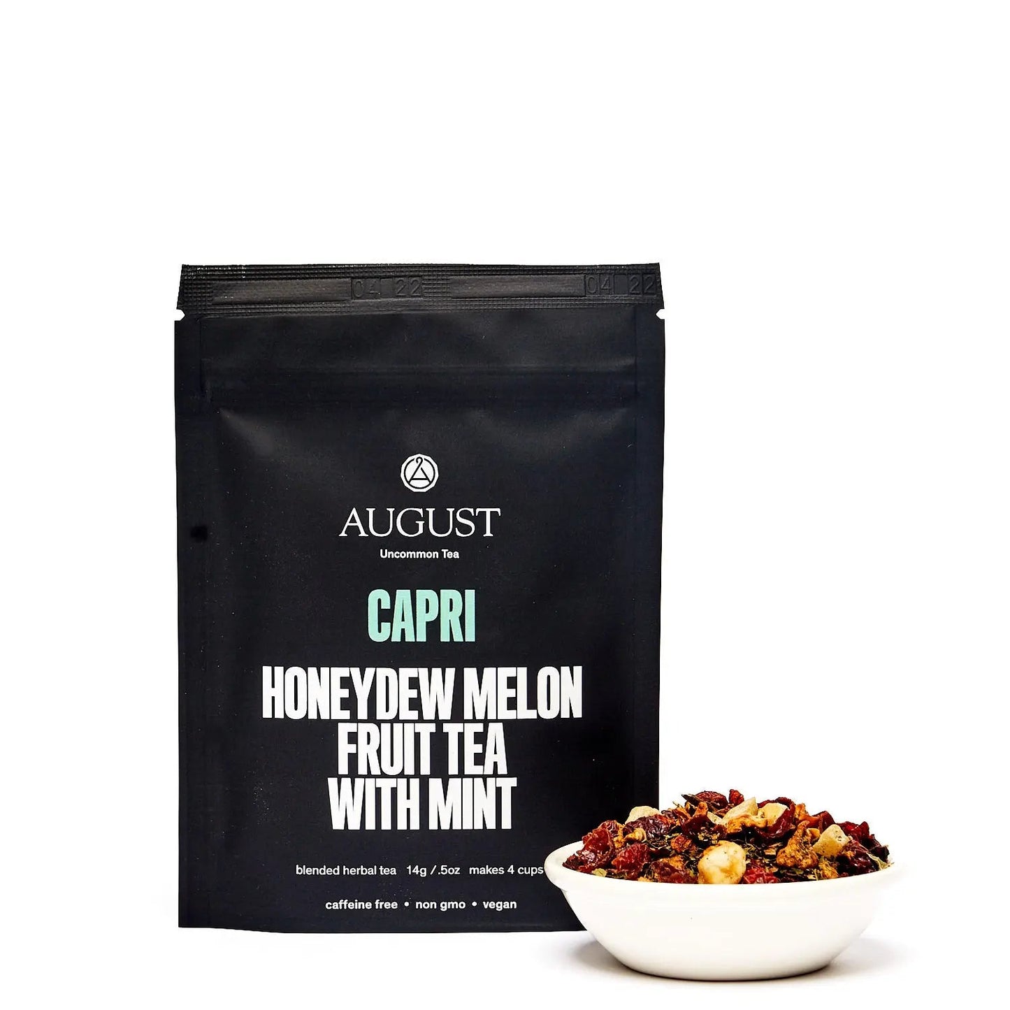 Black tea pouch labeled Capri honeydew melon fruit tea with mint, by August.