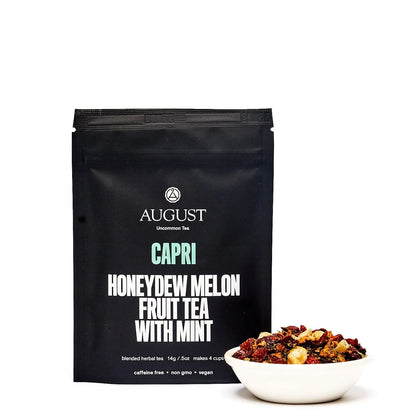 Black tea pouch labeled Capri honeydew melon fruit tea with mint, by August.