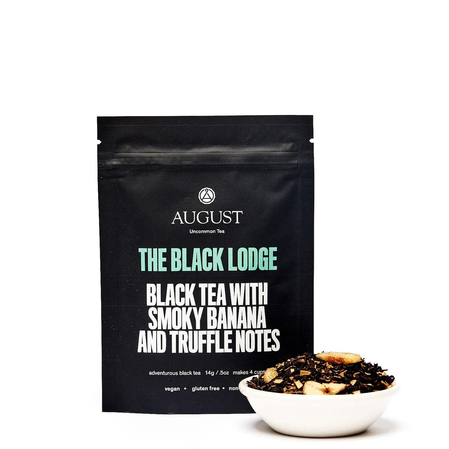 Black tea pouch labeled The Black Lodge with smoky banana and truffle notes