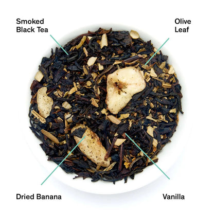 Smoky banana black tea leaves with dried banana pieces in a bowl