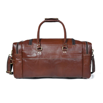 Brown leather weekender duffel with top handles and side pockets with buckles