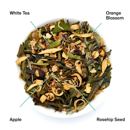Loose white tea blend with orange blossom, apple pieces, and rosehip seed