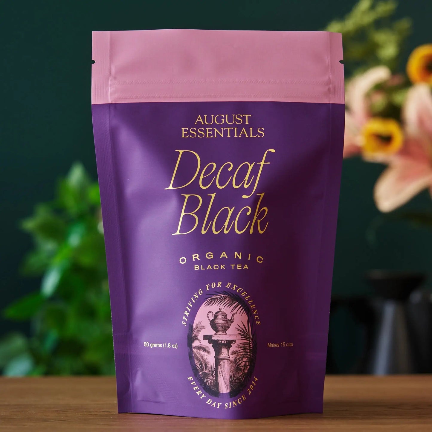 Purple decaf black tea pouch with pink top and Decaf Black label