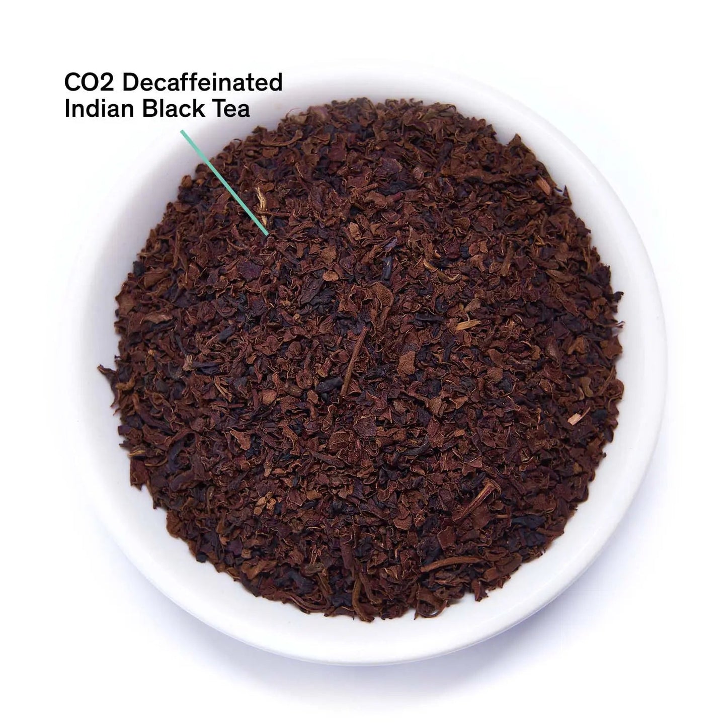 Decaffeinated black tea leaves in a white bowl