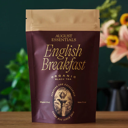 August Essentials English Breakfast black tea pouch, organic black tea, maroon front bag