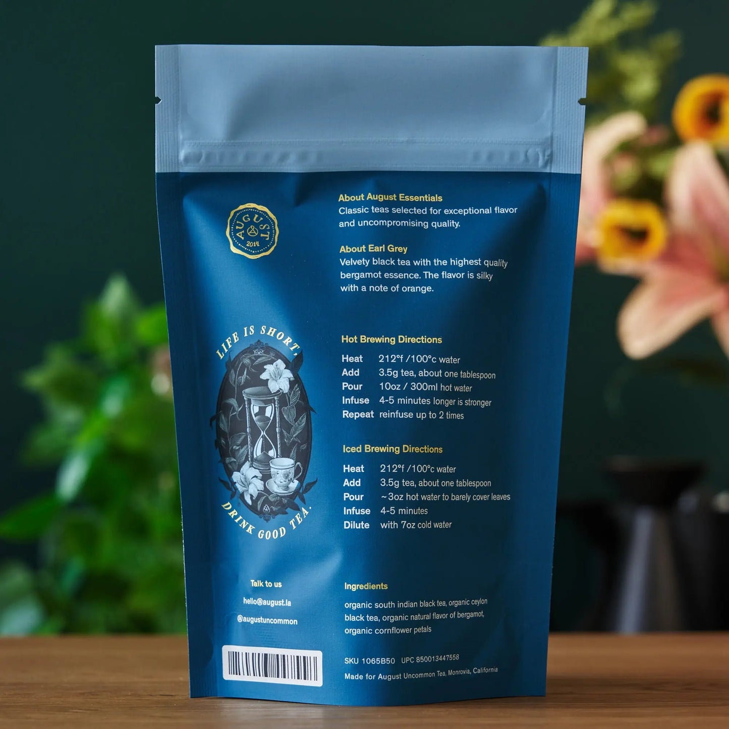 Blue back-side tea pouch with seal and small label details