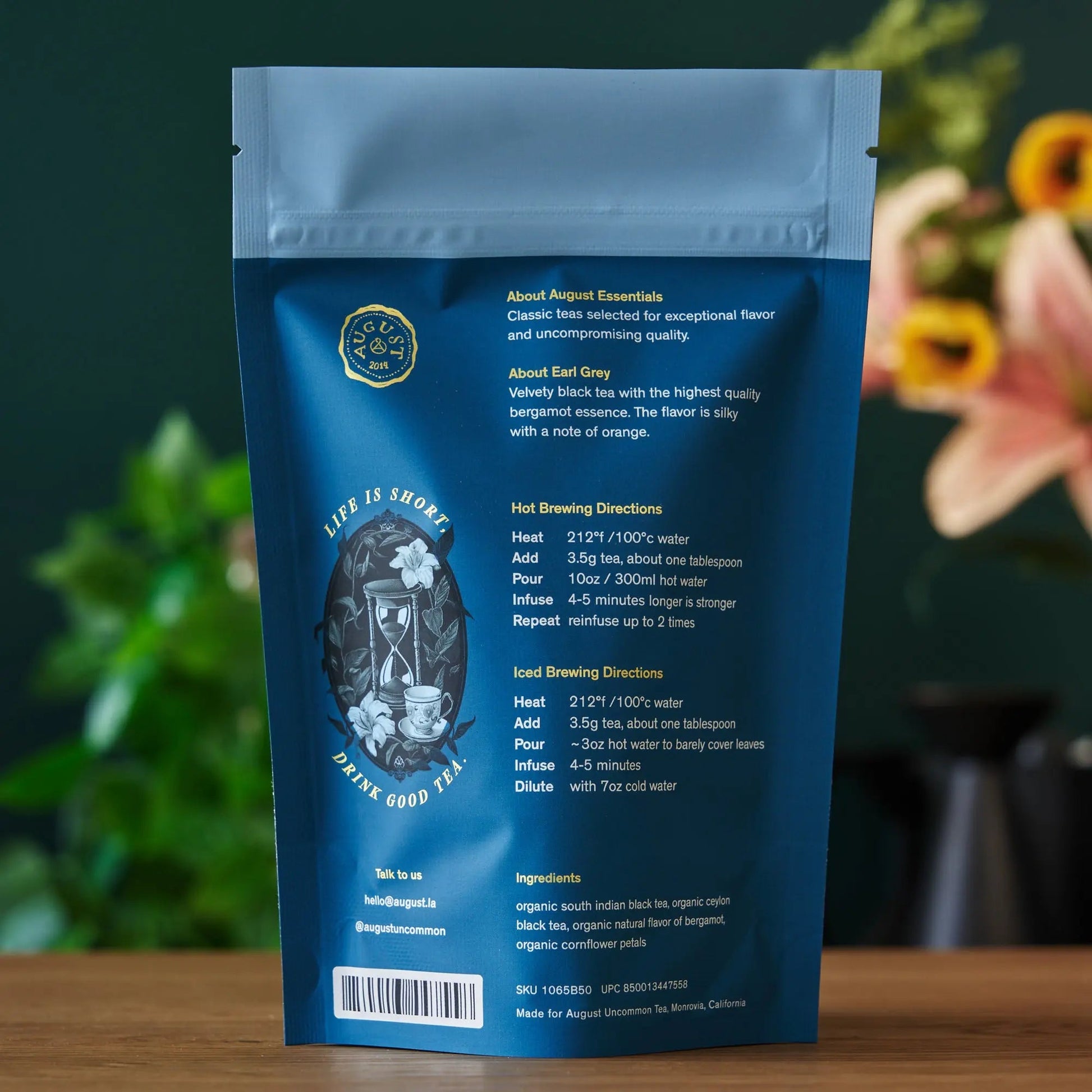 Blue back-side tea pouch with seal and small label details