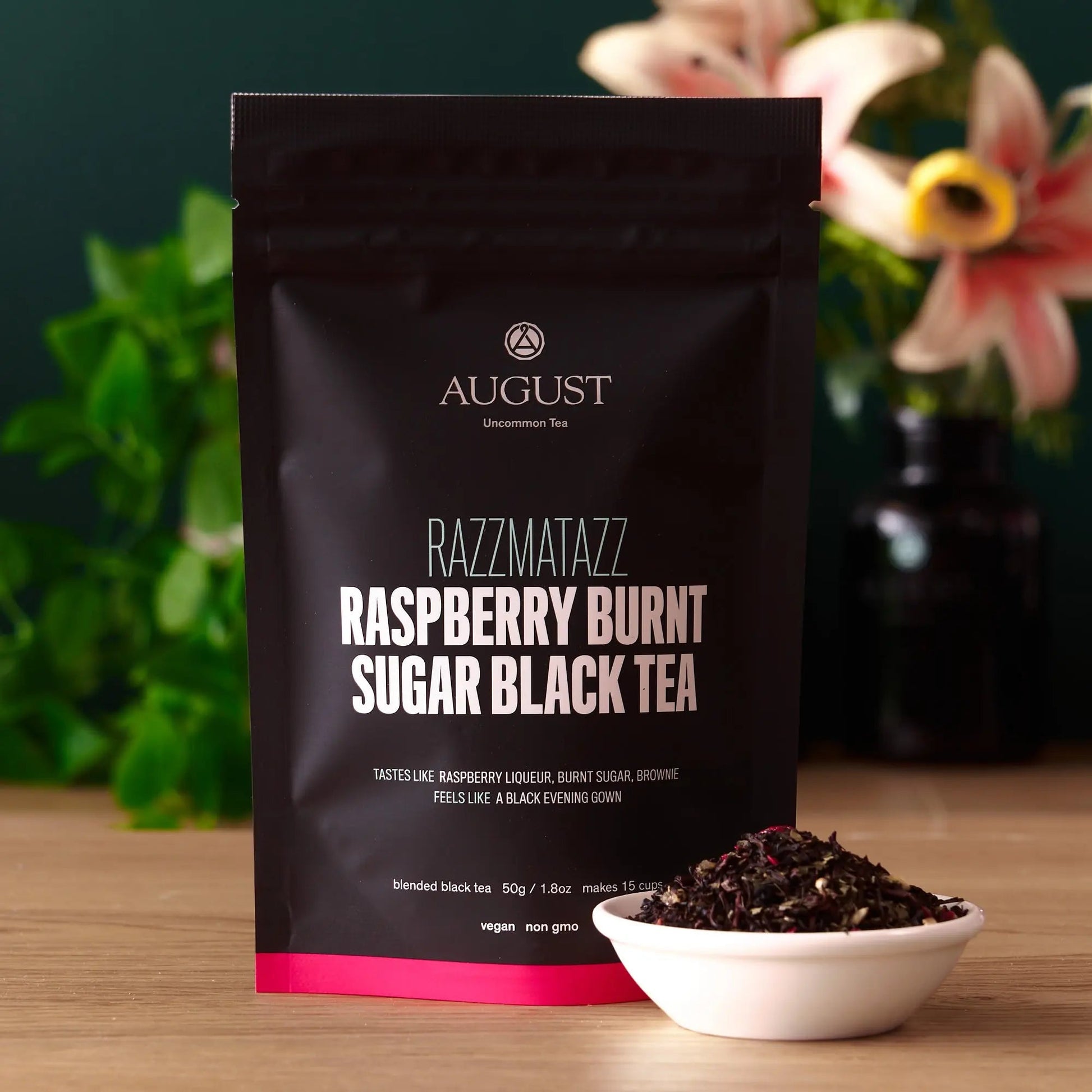 AUGUST RAZZMATAZZ Raspberry Burnt Sugar black tea bag with tea bowl on table