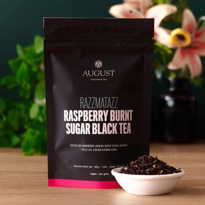 AUGUST RAZZMATAZZ Raspberry Burnt Sugar black tea bag with tea bowl on table