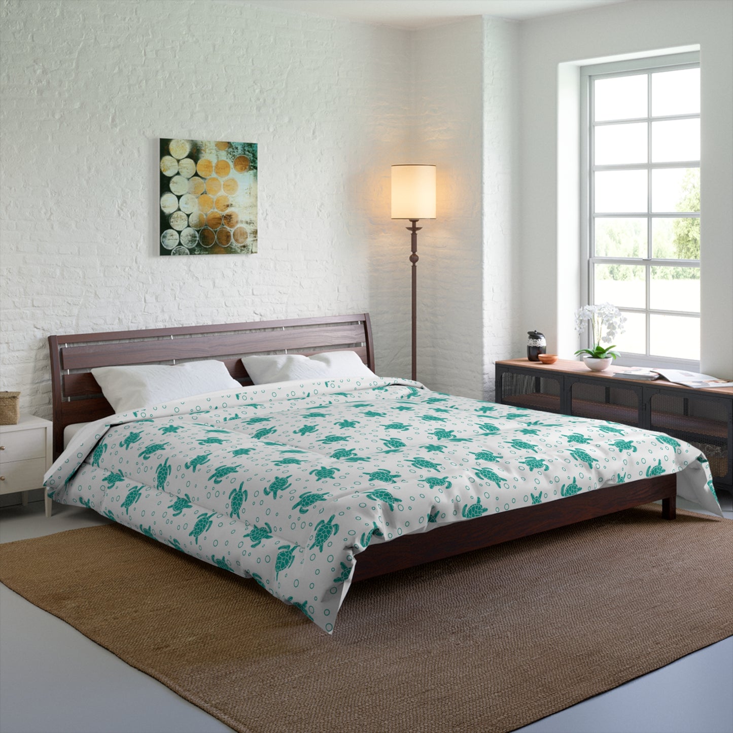 Comforter with teal all-over flower pattern on white, neatly laid on bed