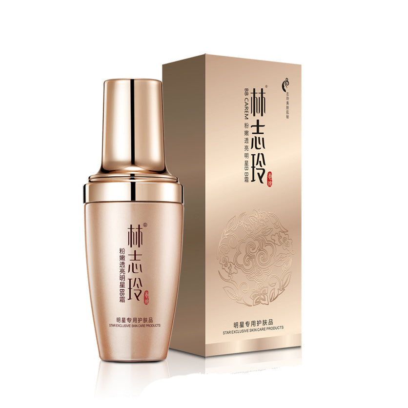 Moisturizing skincare bottle with matching box packaging, gold-toned finish