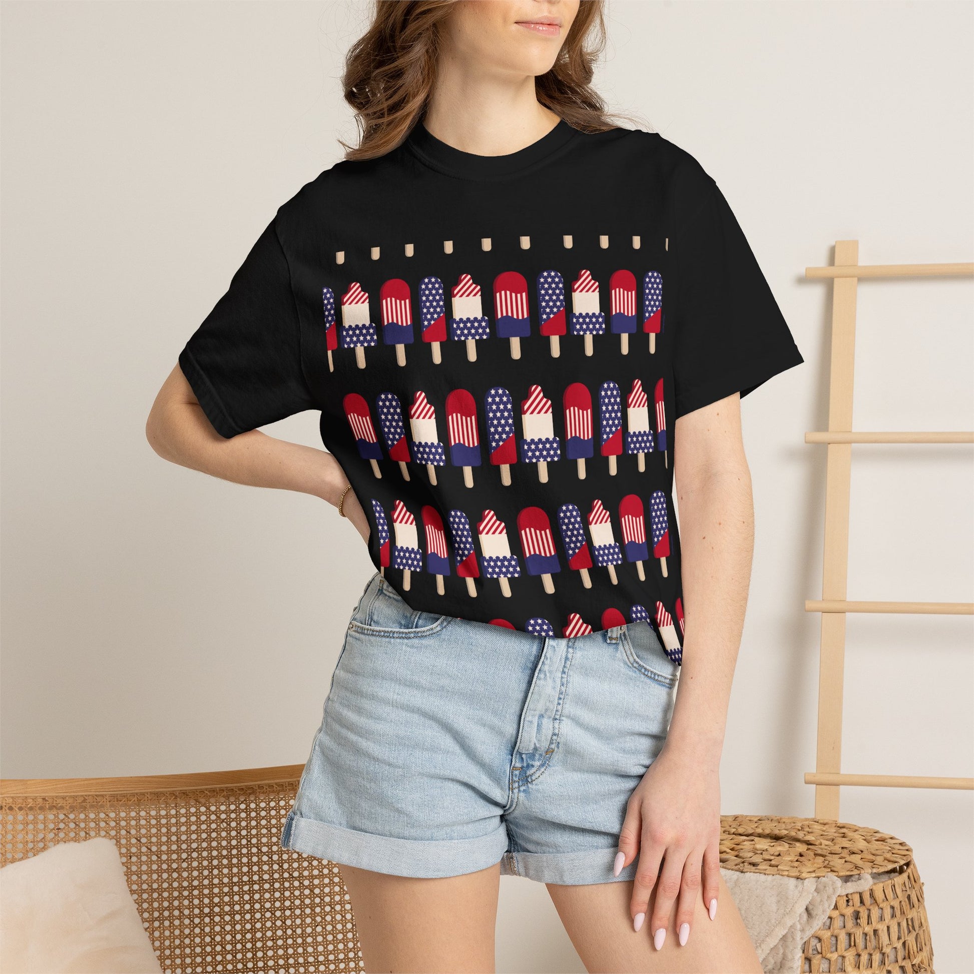 Black T-shirt worn by model; American flag popsicle graphic across chest