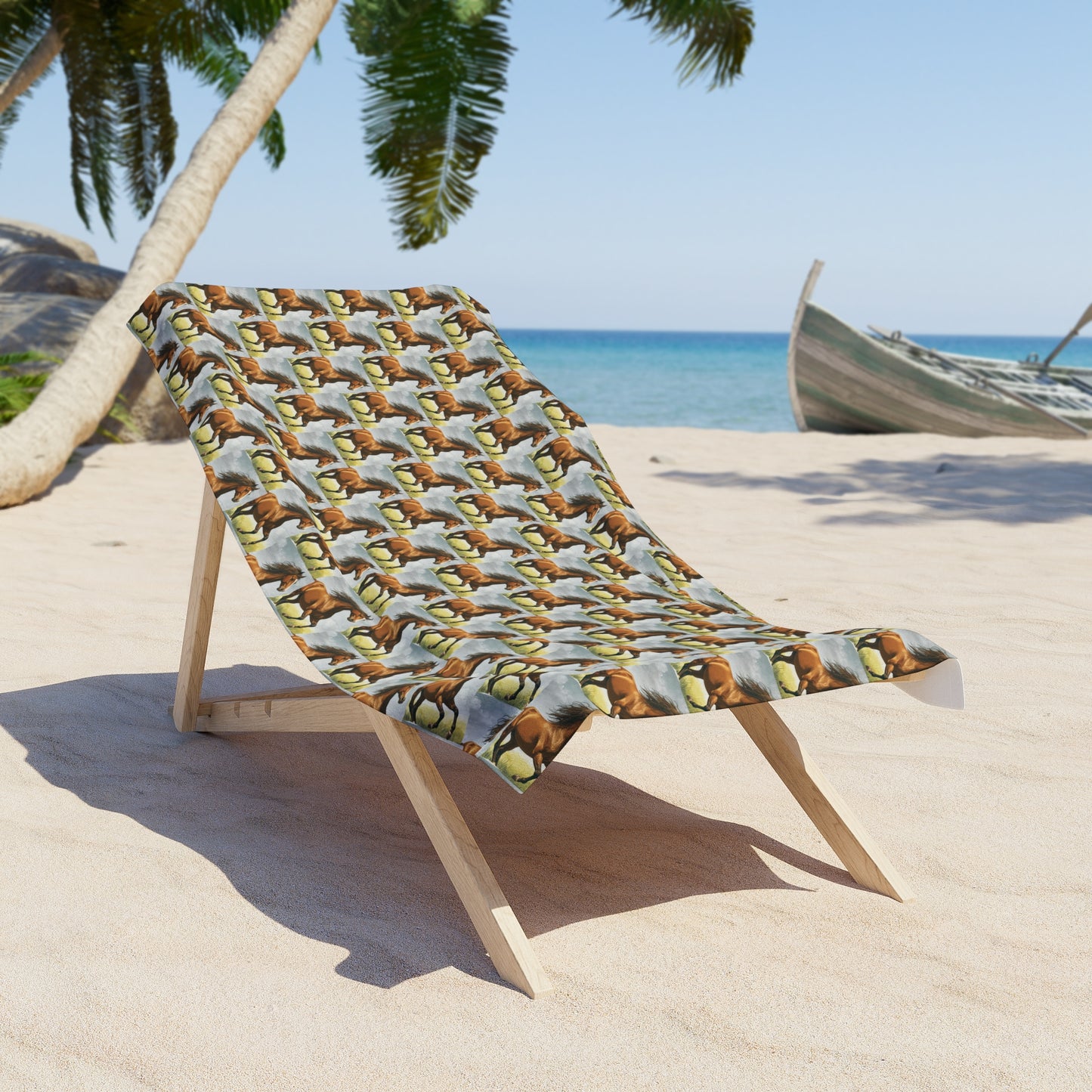 Horse-pattern beach towel draped on a wooden lounge chair, repeating horses on light blue