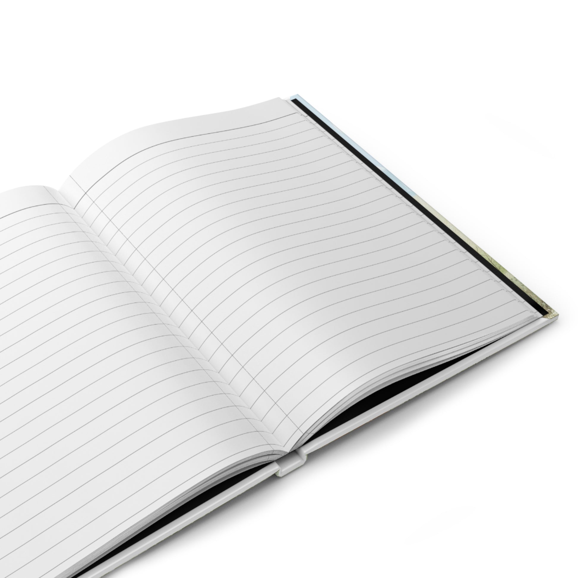Open hardcover journal showing blank lined pages with black spine edge