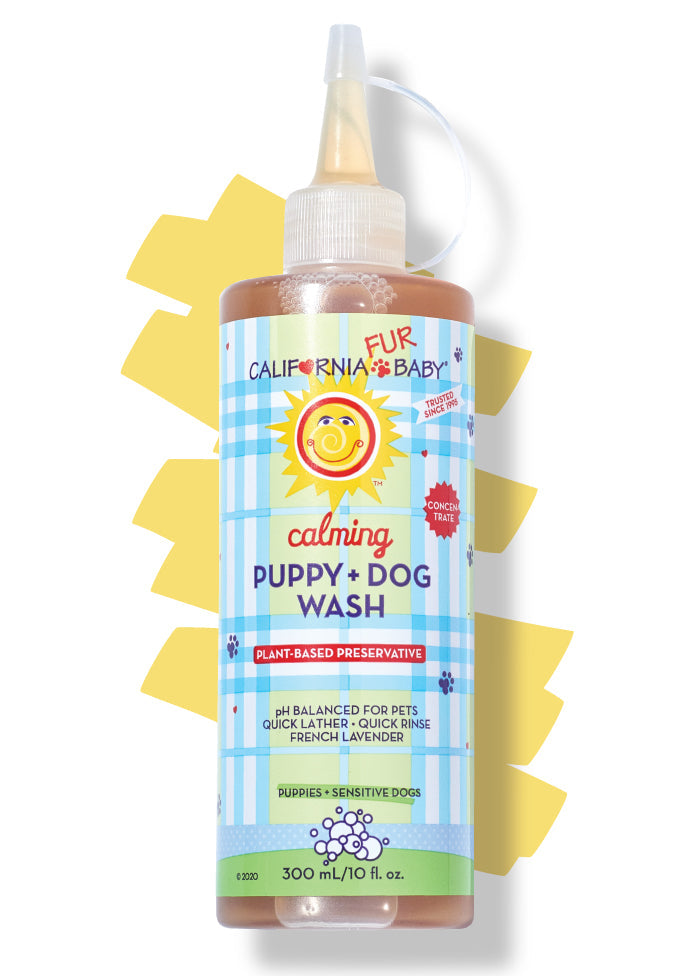 Calming puppy and dog wash bottle with amber liquid and pump dispenser