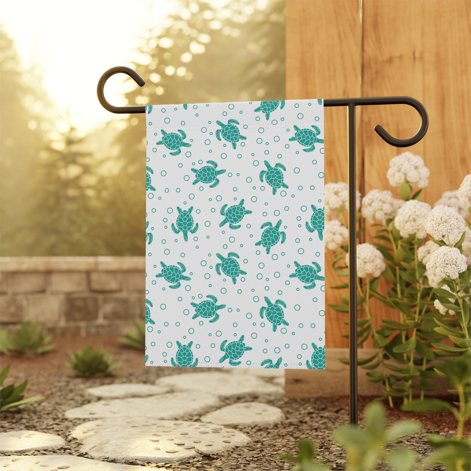 Sea turtle pattern garden flag on black metal stand, teal turtles on white fabric