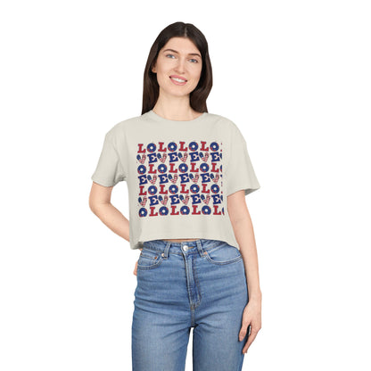 Cream crop graphic tee with multicolor LOLO pattern front, crew neck, short sleeves