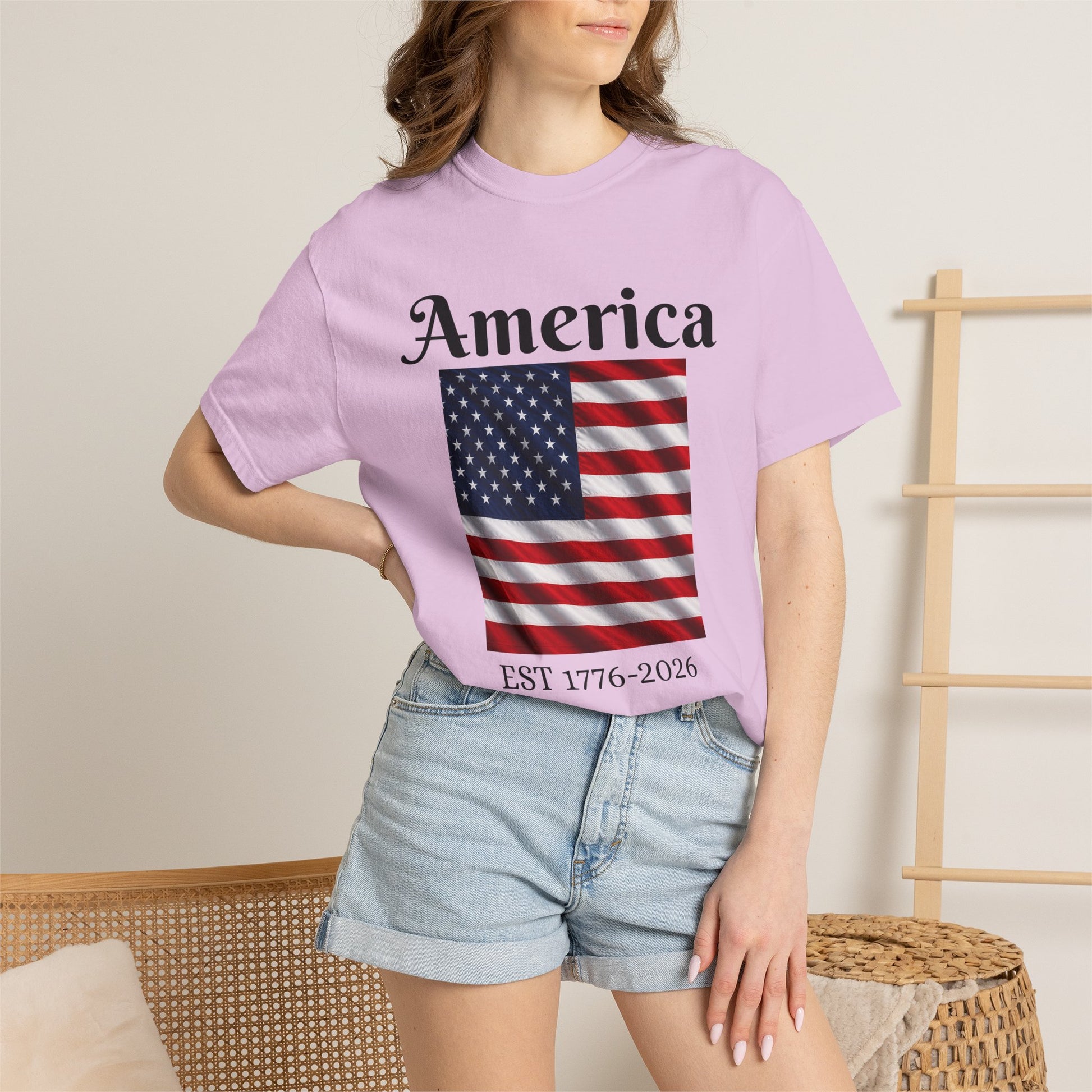Purple America flag T-shirt with EST 1776-2026 text under the design