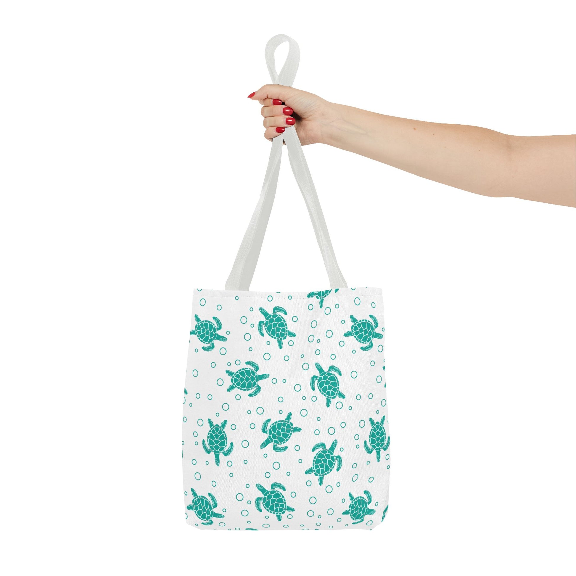 Sea turtle print tote bag with teal turtles on white, white carry handles