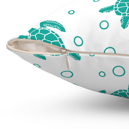 Diagonal side of square pillow showing teal sea turtles, teal circles, and zipper detail