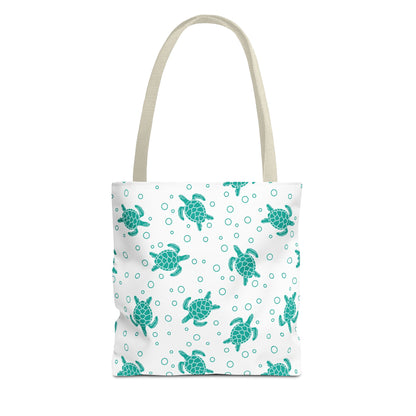 Sea turtle pattern tote bag with teal repeating turtles and beige carry handles