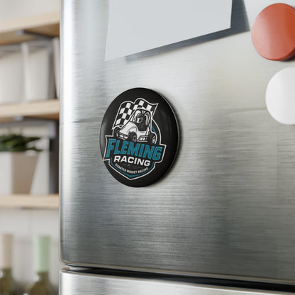 Round Fleming Racing button magnet on brushed metal surface