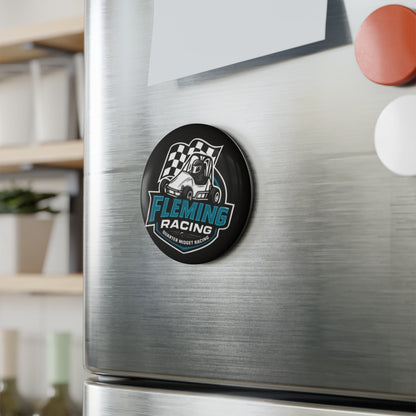 Round black Fleming Racing logo magnet on brushed metal fridge surface