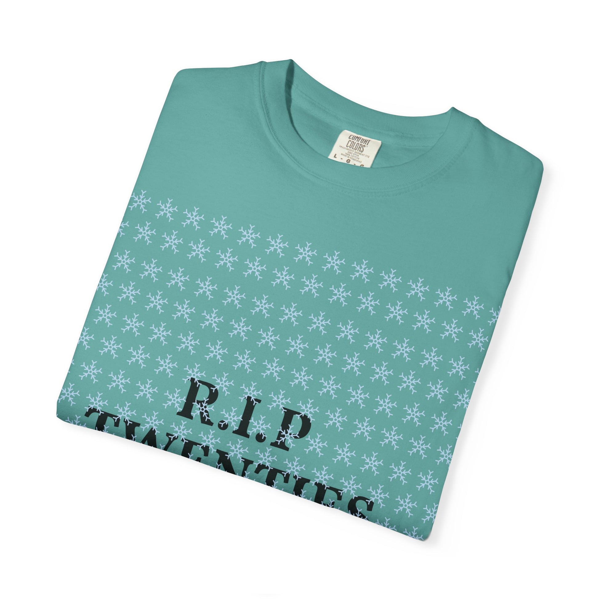 Seafoam unisex garment-dyed T-shirt with white snowflake print and 'R.I.P' text