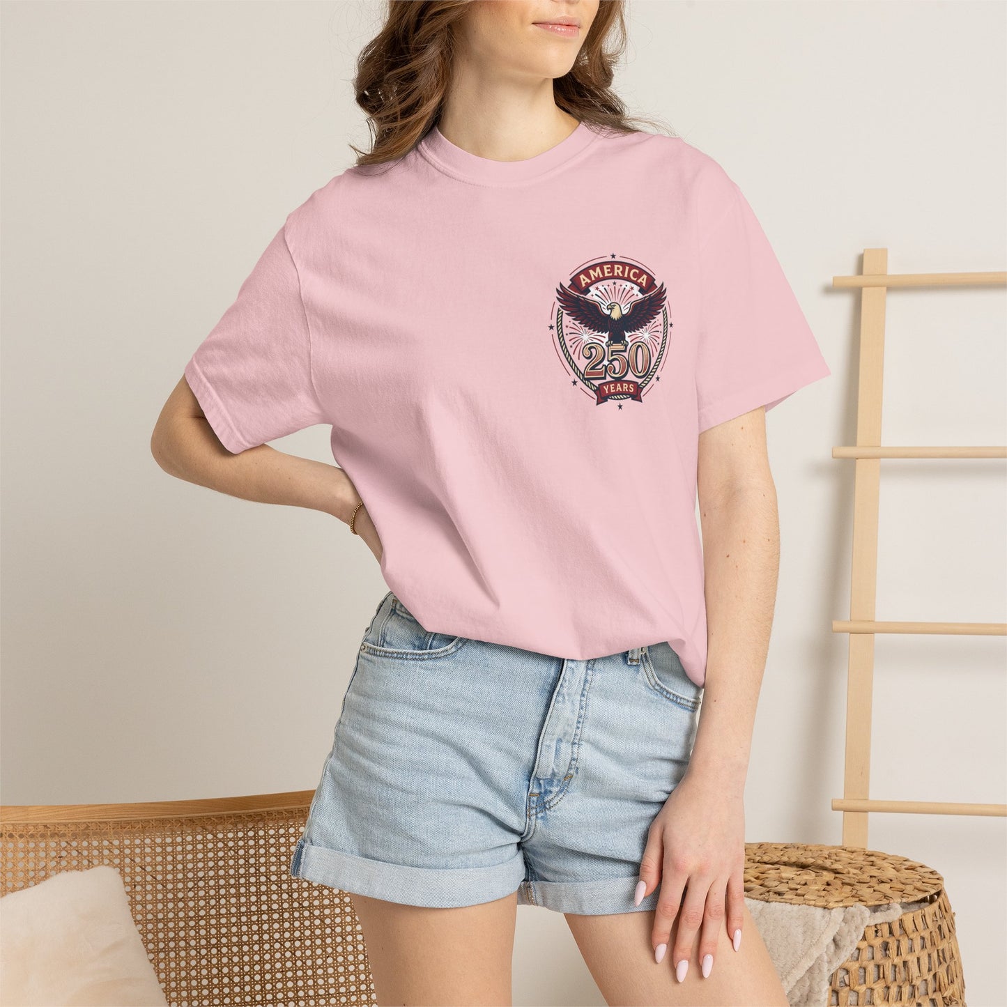 Pink T-shirt with America 250 circular eagle logo on chest, crew neck