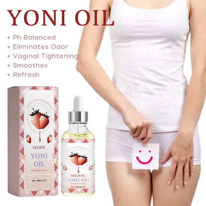 Intimate essential oil bottle with dropper and box beside legs holding a smile card