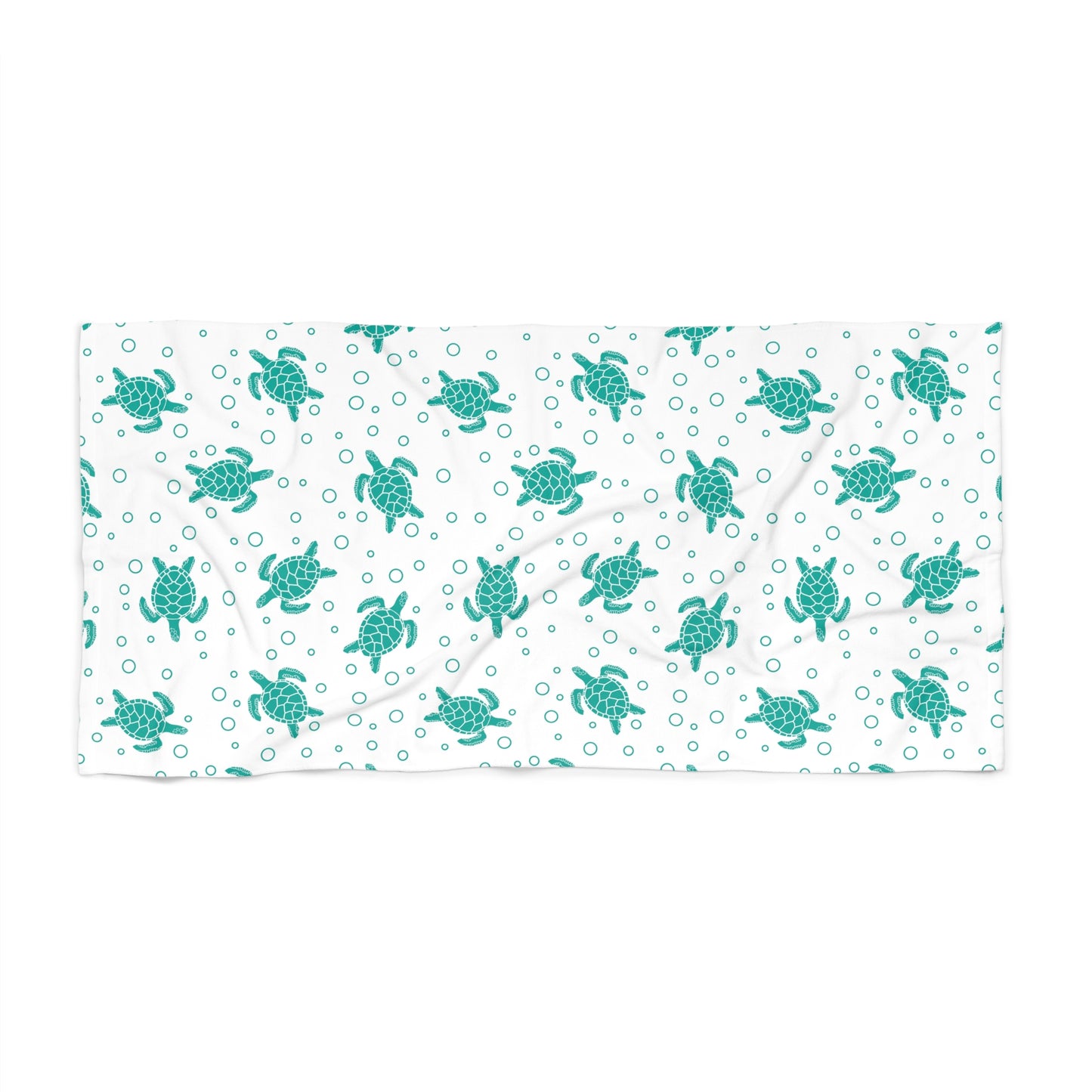 Beach towel with teal sea turtle pattern on white, rectangular folded layout