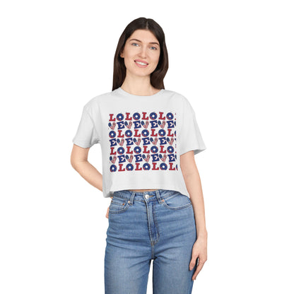 Crop graphic tee on model, white with multicolor LOLO print and crew neckline