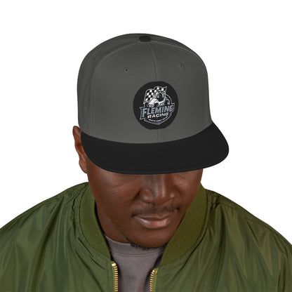 Embroidered baseball cap on model, dark gray crown with black brim and ghost racing patch