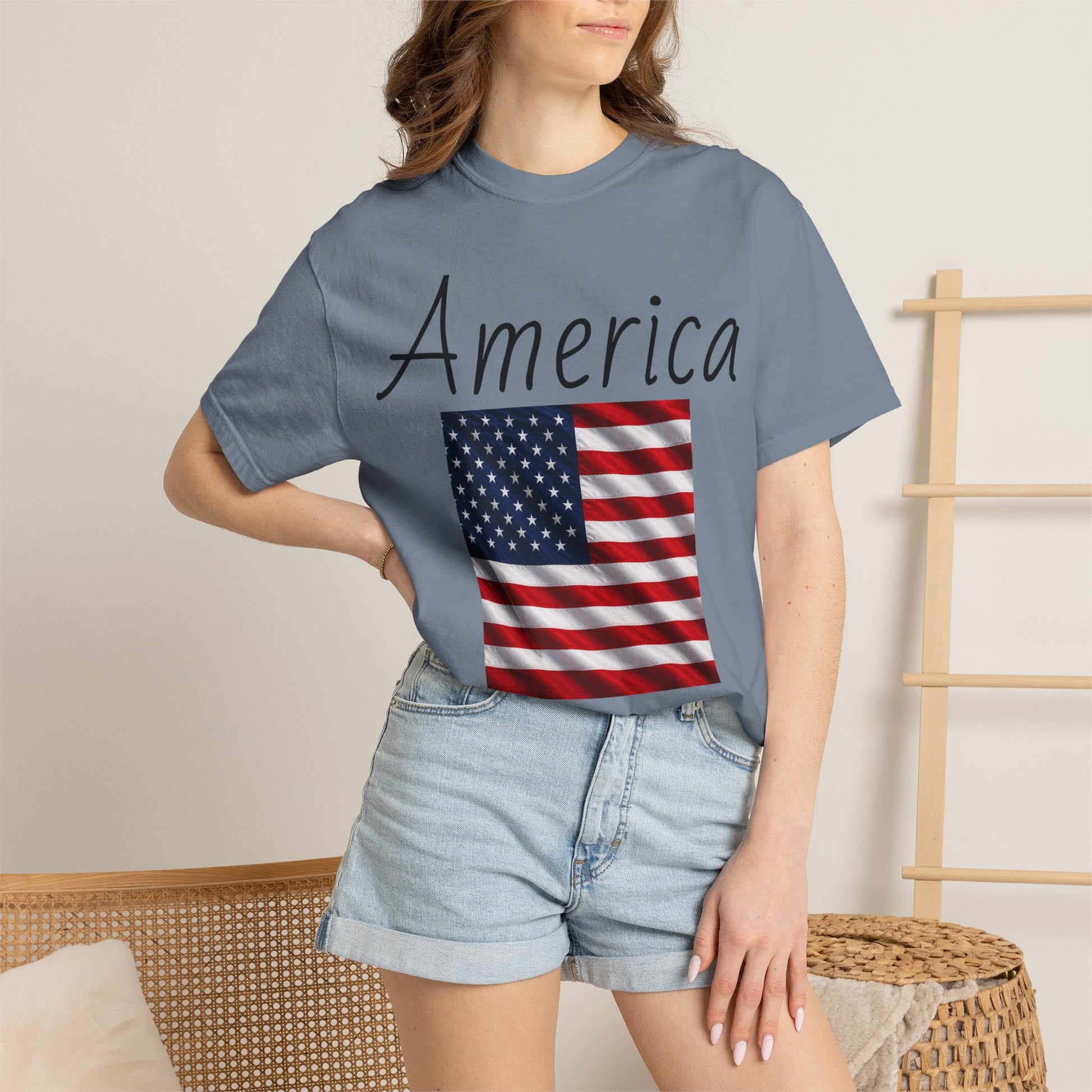 Unisex T-shirt, heather blue, “America” text with U.S. flag graphic on front
