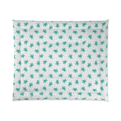 Comforter with teal all-over floral pattern on white, corner edge view
