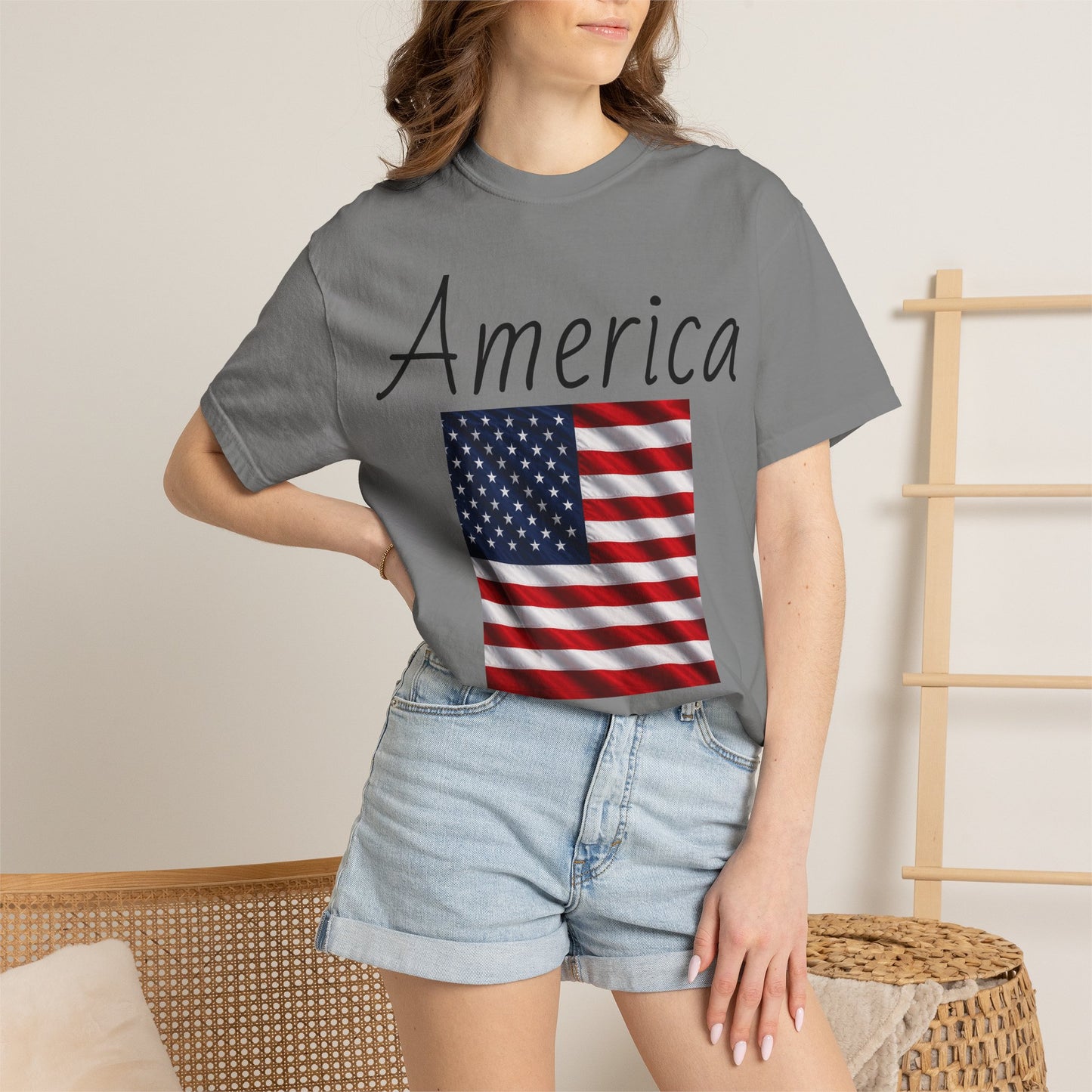 Unisex graphic T-shirt, charcoal gray with “America” script and U.S. flag print