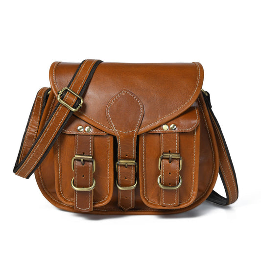 Brown leather womens 2-pocket sling bag with flap, front straps, and adjustable shoulder strap