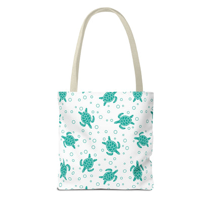 Sea turtle print tote bag with teal turtles on white, beige carry handles