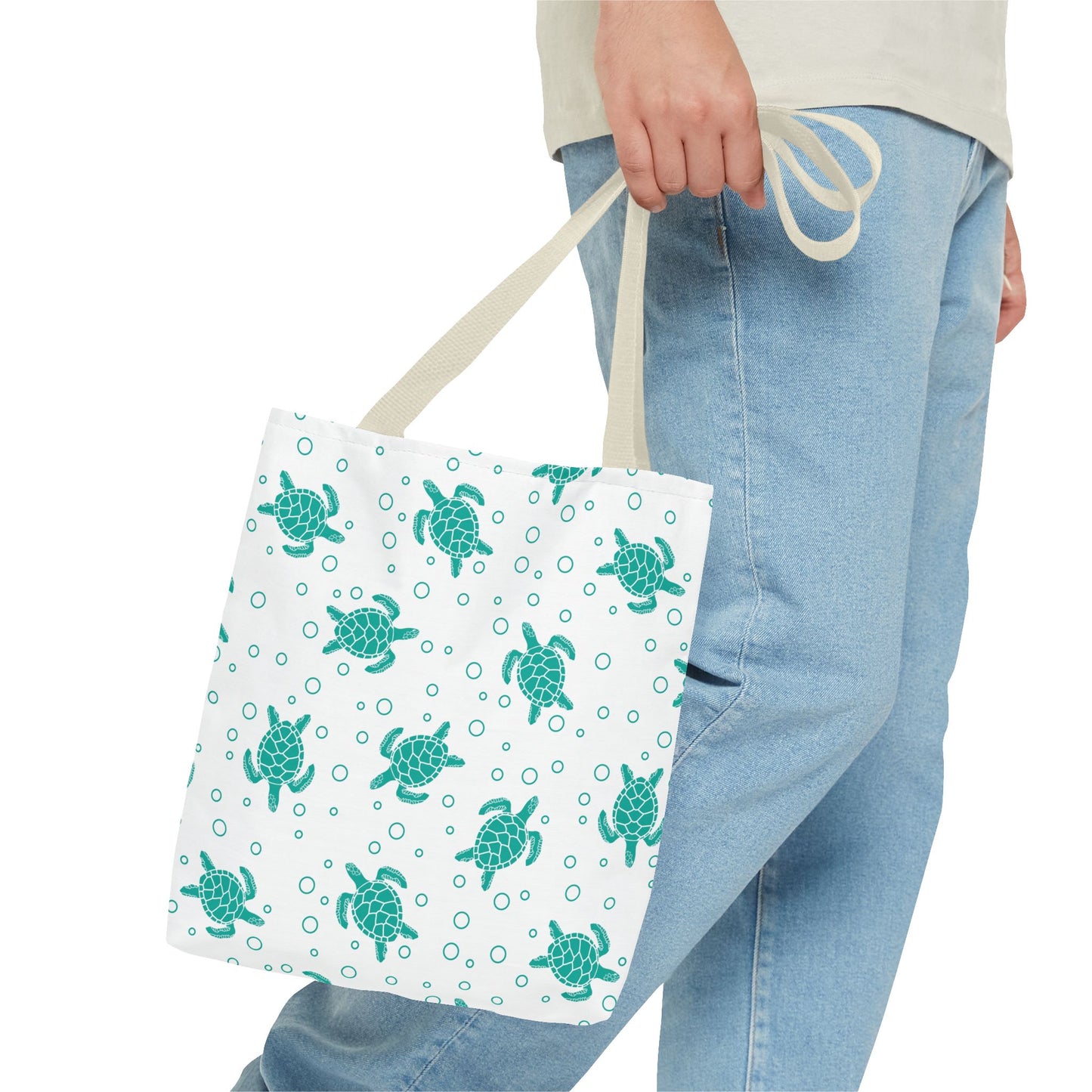 Sea turtle print tote bag with teal turtles on white, beige carry handles