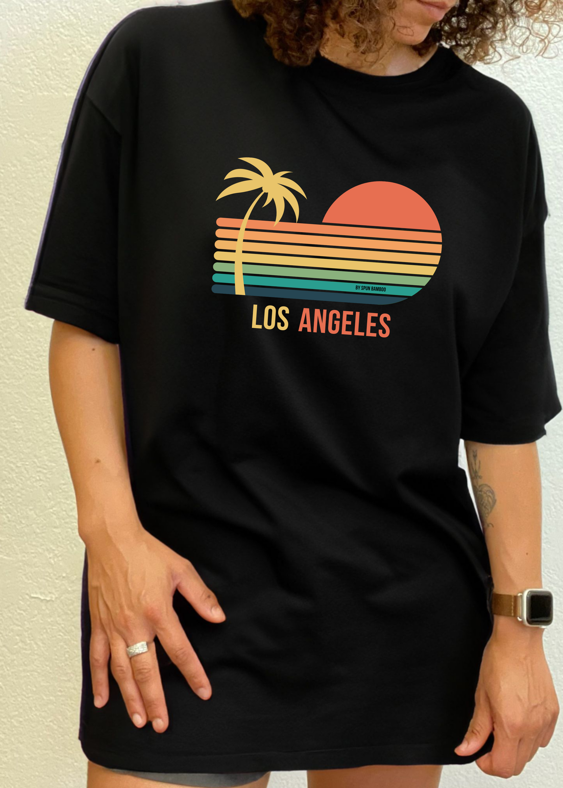 Black unisex graphic short-sleeve T-shirt with palm, sunset, and “Los Angeles” print