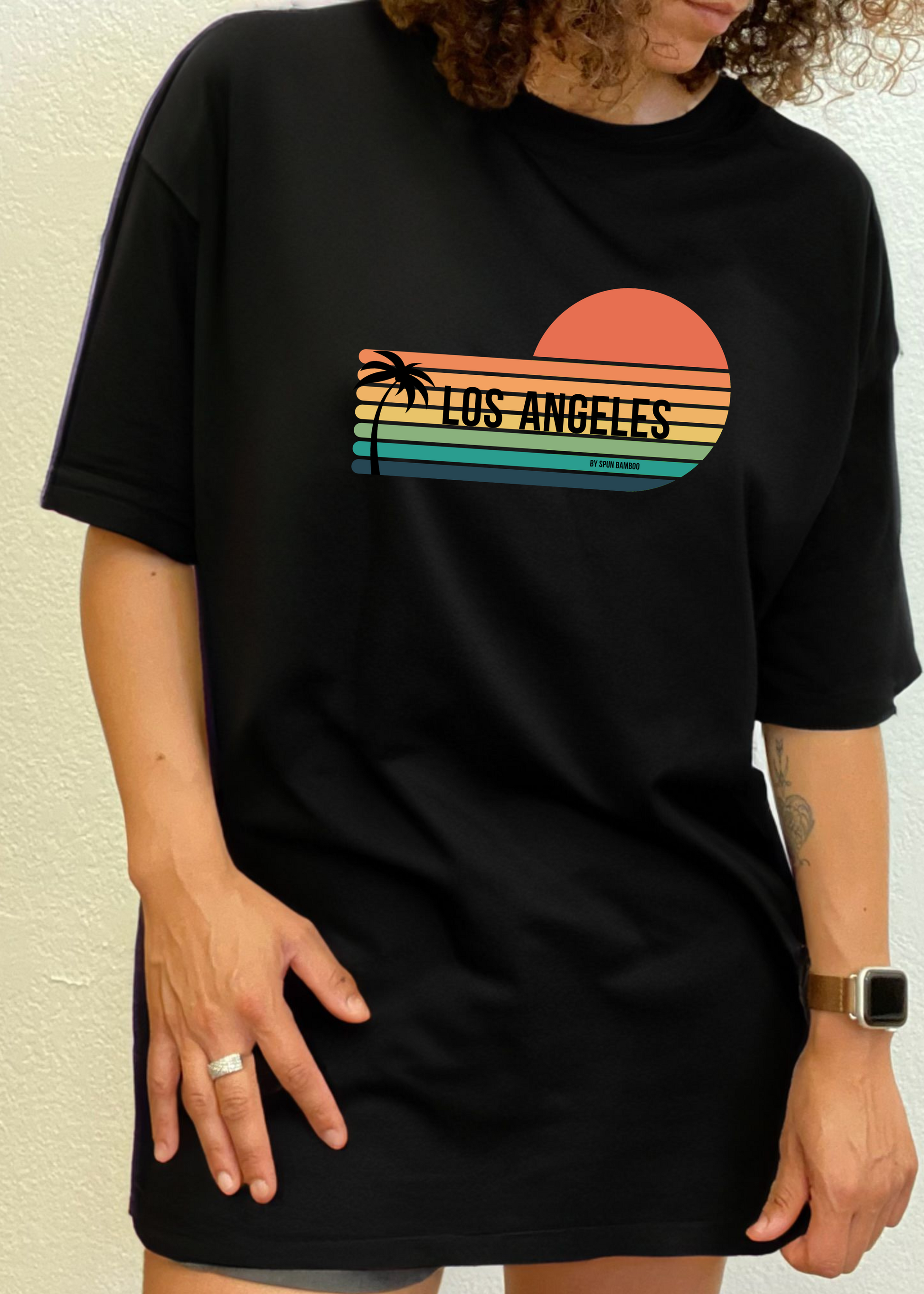 Unisex short-sleeve graphic T-shirt in black with Los Angeles sunset palm print