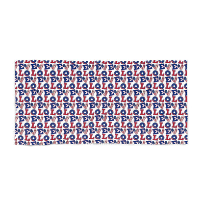 Rectangular beach towel laid flat, repeating LOL icons in red, white, and blue