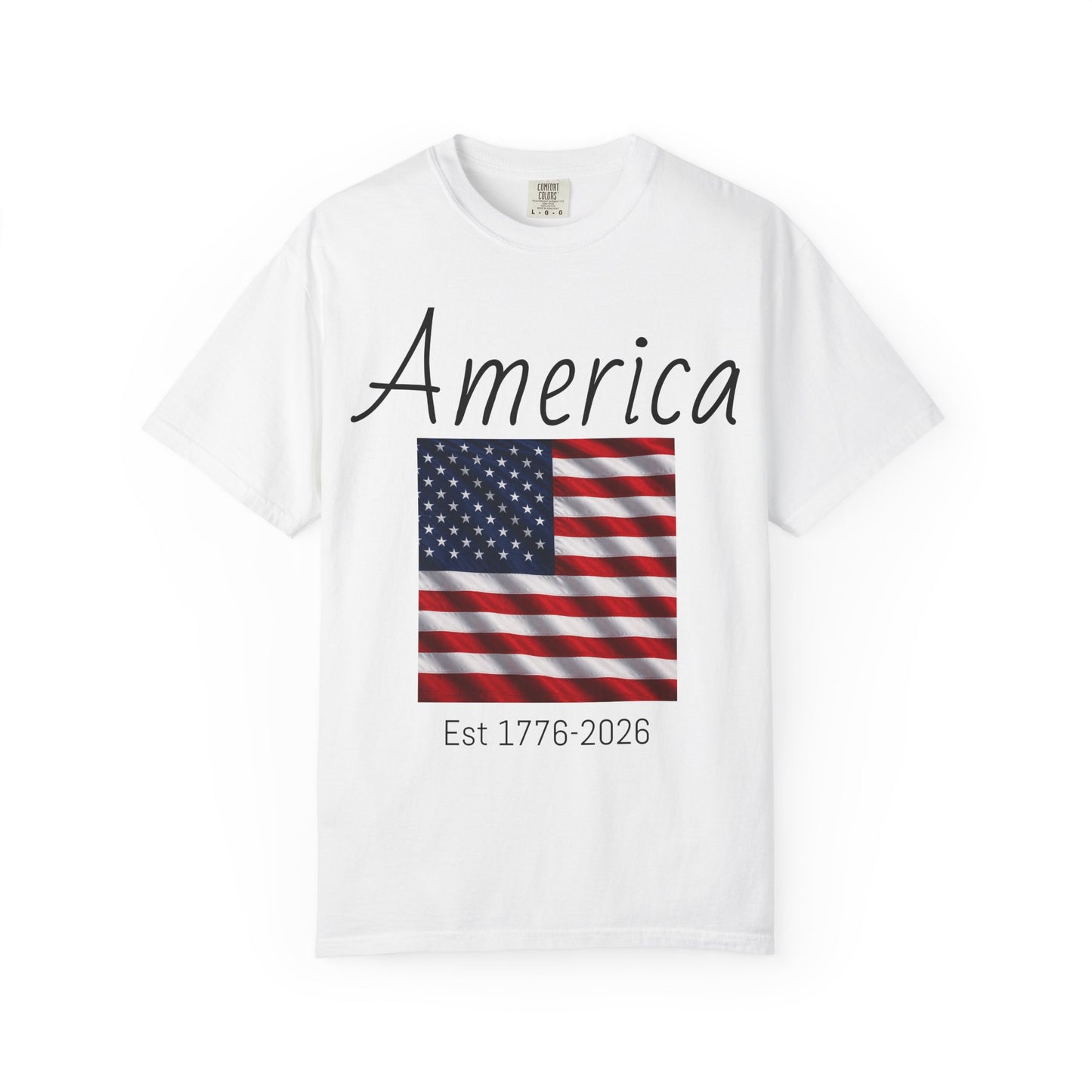 White unisex t-shirt with “America” script, US flag graphic, and “Est 1776-2026”