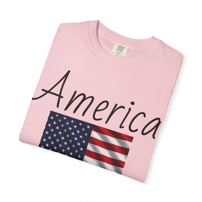 Soft pink unisex T-shirt with 'America' script and US flag graphic on front