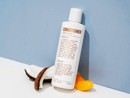 Natural conditioner bottle with pump, back label facing camera