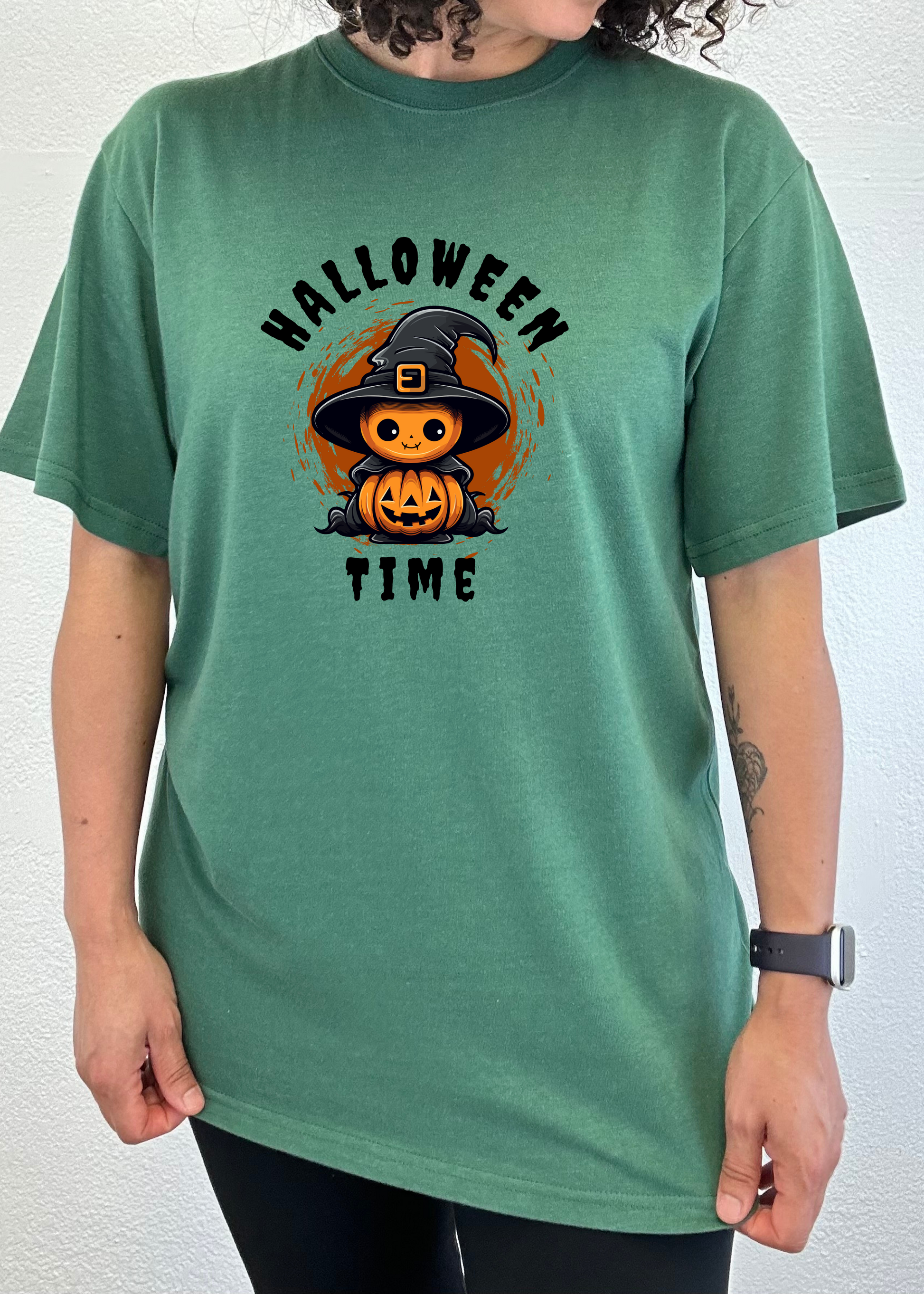 Unisex Halloween graphic T-shirt, crew neck; teal green short sleeve with witch-pumpkin front print