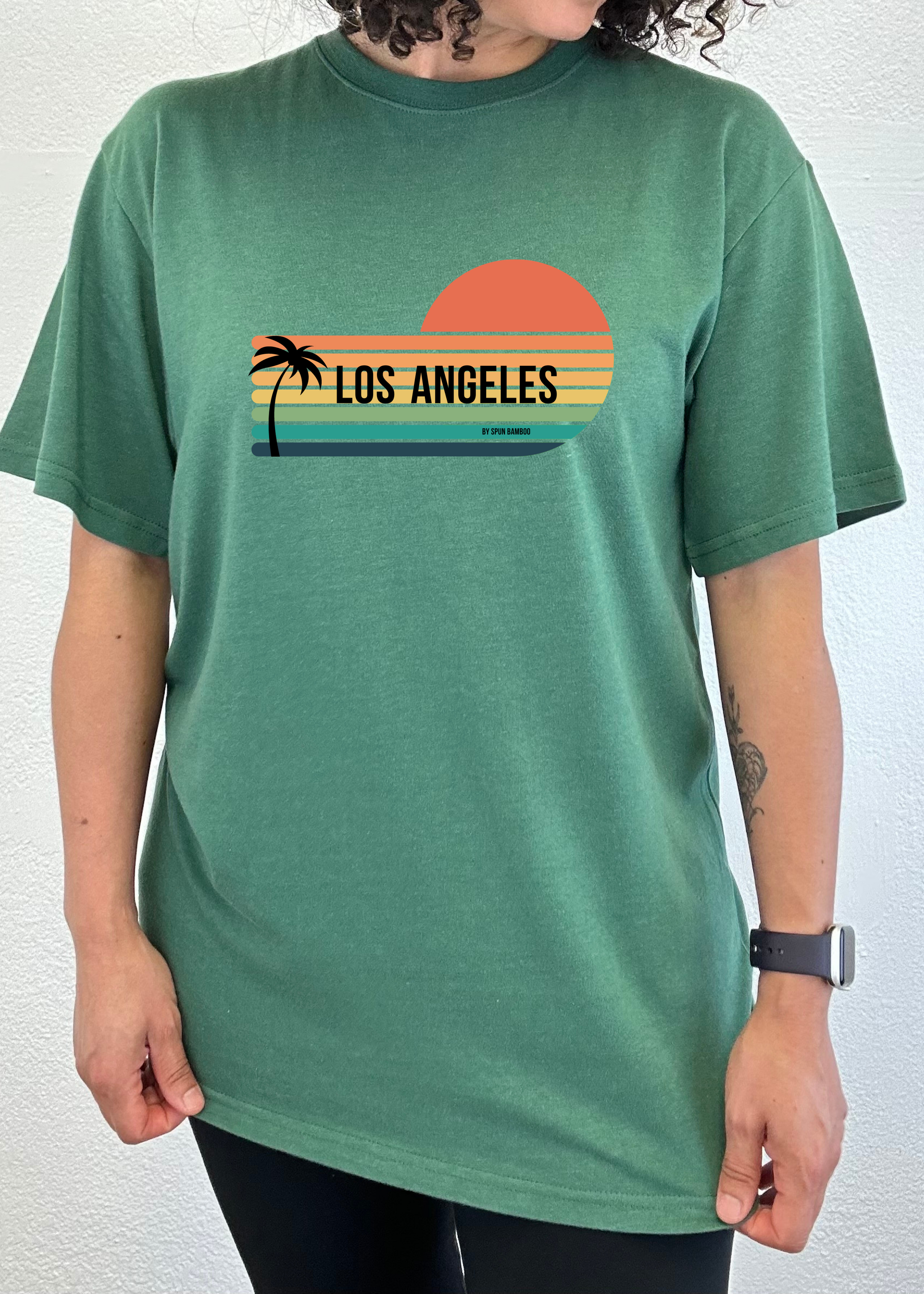 Unisex short-sleeve graphic T-shirt in green with Los Angeles sunset palm print