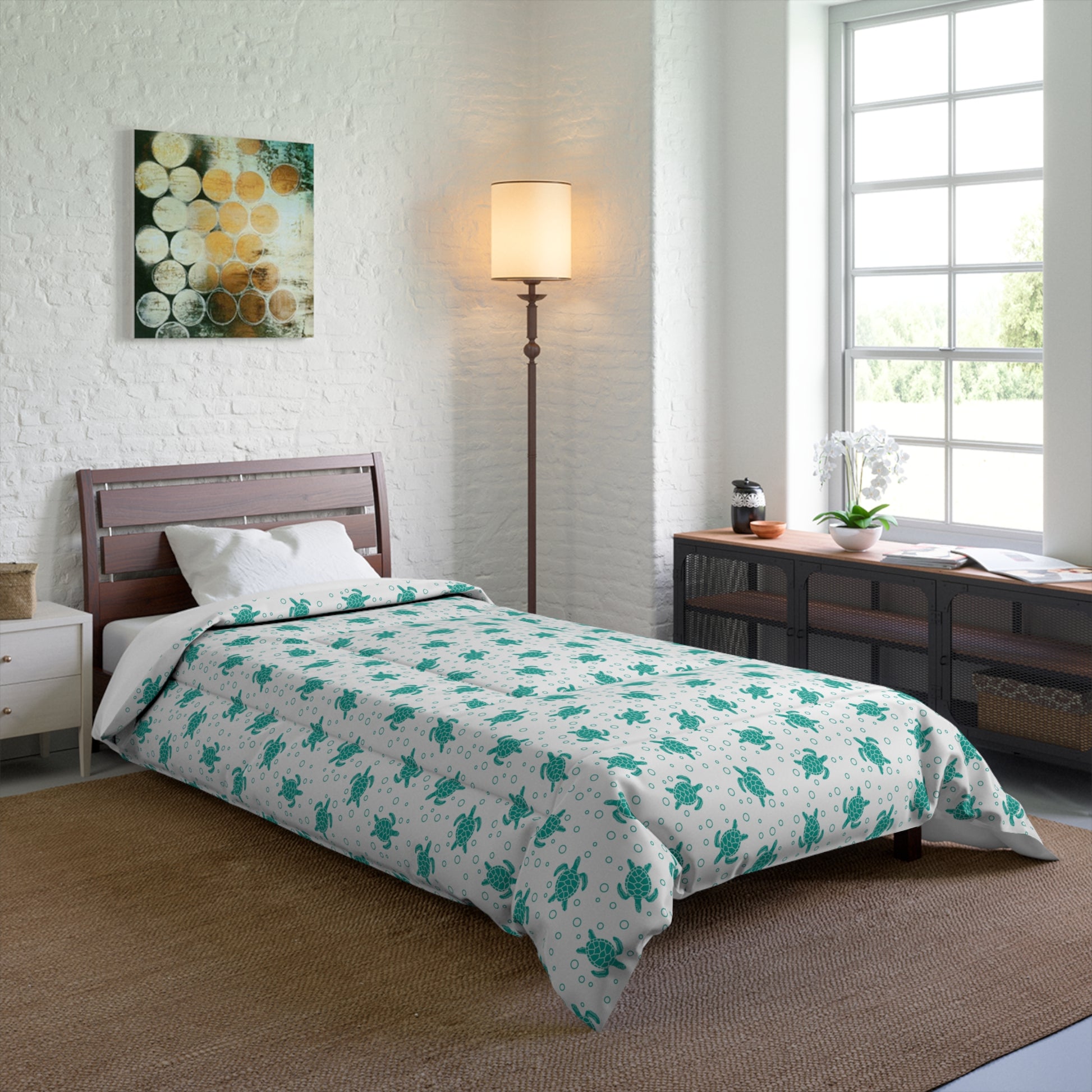 Bed comforter featuring teal all-over floral print on white, draped over mattress