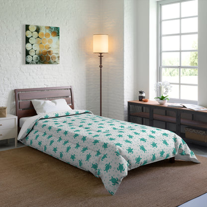 Bed comforter featuring teal all-over floral print on white, draped over mattress