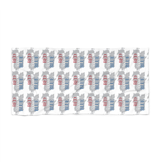 White beach towel with repeating red and blue script pattern